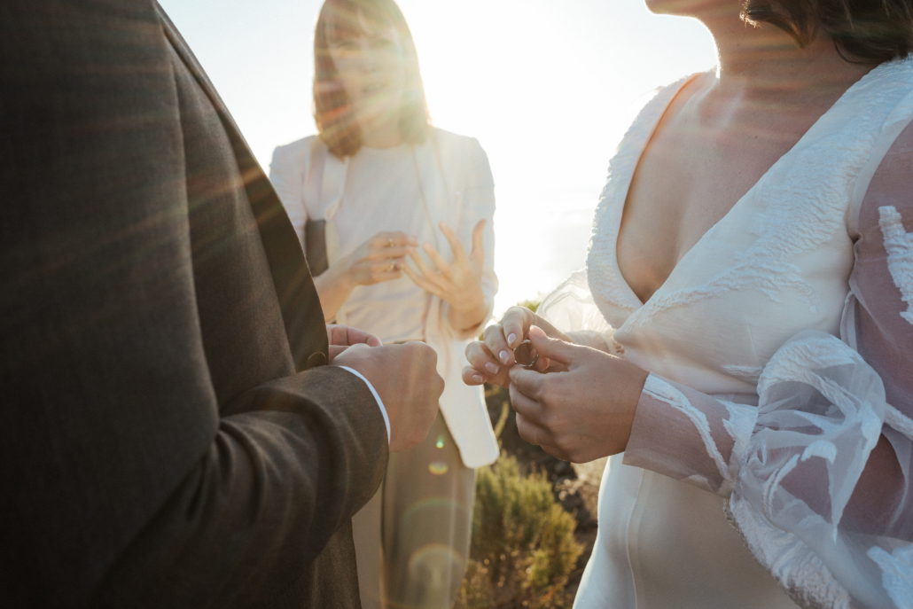 A couple exchanging rings during an intimate Cape Town elopement ceremony